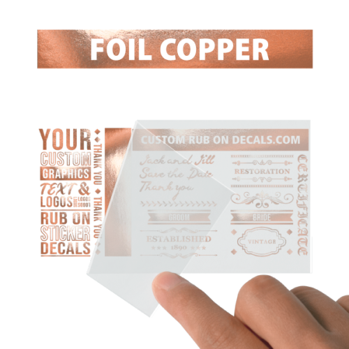 A person is holding up a card with the word foil copper on it.